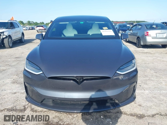 2022 Tesla Model X with VIN 7SAXCDE54NF342256, listed as a IAAI auction lot 41991212 with 28,740 mi miles and . Bid and sale history available at DreamBid. Image 12.