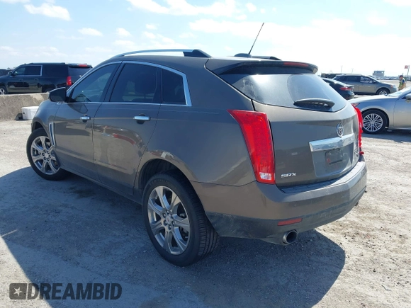 2015 Cadillac SRX Performance Collection with VIN 3GYFNCE31FS598109, listed as a IAAI auction lot 41788267 with 172,488 mi miles and . Bid and sale history available at DreamBid. Image 3.