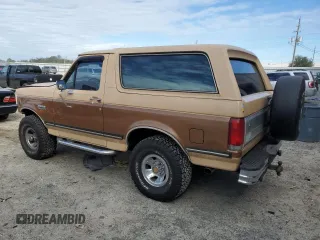 1987 Ford Bronco Custom with VIN 1FMEU15H6HLA11430, listed as a Copart auction lot 89069465 with 2,155 mi miles and Salvage Title. Bid and sale history available at carsss.com. Image 2.