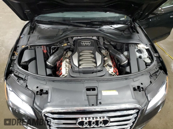 2011 Audi A8 z VIN WAURVAFD8BN005569, wystawiony jako Copart lot #52101065 z przebiegiem 104 893 mil mil oraz Szkody całkowita. Historia ofert i sprzedaży dostępna na DreamBid. Obrazek 11.