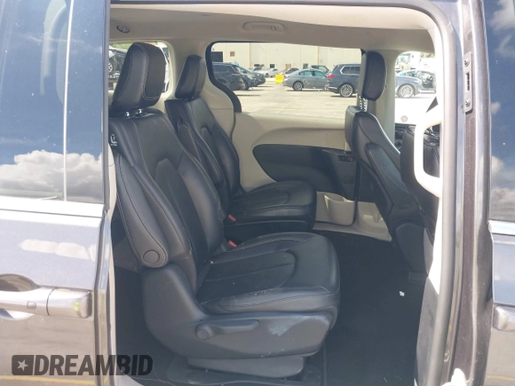 2023 Chrysler Pacifica Hybrid Touring L with VIN 2C4RC1L74PR579782, listed as a IAAI auction lot 42487390 with Not provided miles and . Bid and sale history available at DreamBid. Image 8.