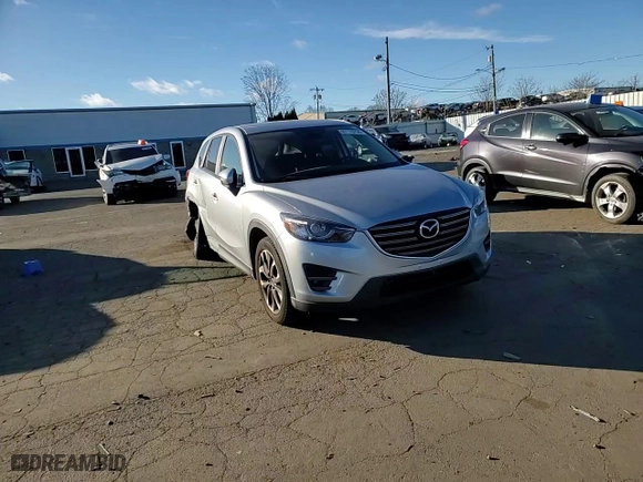 2016 Mazda CX-5 Grand Touring with VIN JM3KE4DYXG0713698, listed as a Copart auction lot 87176794 with 114,435 mi miles and Salvage Title. Bid and sale history available at carsss.com. Image 10.