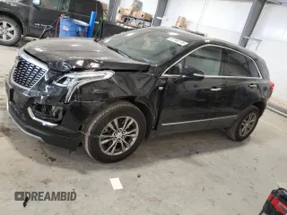 2023 Cadillac XT5 AWD Premium Luxury with VIN 1GYKNDRS0PZ147473, listed as a Copart auction lot 87746115 with 34,419 mi miles and Salvage Title. Bid and sale history available at DreamBid. Image 1.