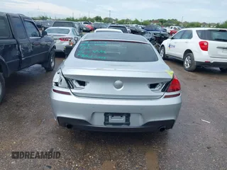 2015 BMW 6 Series 640i z VIN WBA6A0C51FD318982, wystawiony jako IAAI lot #41875547 z przebiegiem 60 968 mil mil oraz . Historia ofert i sprzedaży dostępna na DreamBid. Obrazek 16.