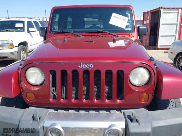 2011 Jeep Wrangler Unlimited Sahara with VIN 1J4BA5H15BL557871, listed as a IAAI auction lot 41922328 with 206,581 mi miles. Bid and sale history available at carsss.com. Image 13.