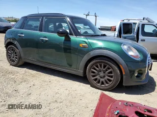 2015 MINI Hardtop 4 Door with VIN WMWXS5C56FT830564, listed as a Copart auction lot 55784695 with 52,089 mi miles and Salvage Title. Bid and sale history available at DreamBid. Image 4.