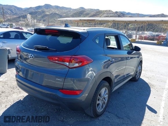 2018 Hyundai Tucson SEL with VIN KM8J3CA42JU618764, listed as a IAAI auction lot 41677046 with 127,980 mi miles. Bid and sale history available at carsss.com. Image 4.