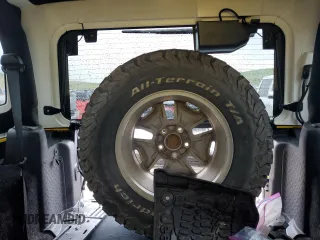 2015 Jeep Wrangler Rubicon with VIN 1C4BJWCG8FL691061, listed as a Copart auction lot 56528213 with 100,927 mi miles and . Bid and sale history available at DreamBid. Image 10.