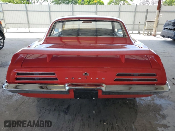 1969 Pontiac Firebird z VIN 223379ULL6573, wystawiony jako Copart lot #57812295 z przebiegiem 142 mil mil oraz Tytuł czysty. Historia ofert i sprzedaży dostępna na DreamBid. Obrazek 6.