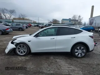 2022 Tesla Model Y Long Range with VIN 7SAYGAEE4NF516625, listed as a IAAI auction lot 41892225 with 33,054 mi miles and . Bid and sale history available at DreamBid. Image 14.