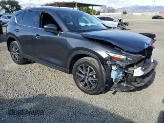 2018 Mazda CX-5 Grand Touring with VIN JM3KFADM8J1330353, listed as a Copart auction lot 54752325 with 96,577 mi miles and Salvage Title. Bid and sale history available at DreamBid. Image 4.