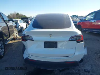 2023 Tesla Model Y Long Range with VIN 7SAYGAEE3PF753657, listed as a IAAI auction lot 41668917 with 33,301 mi miles and . Bid and sale history available at DreamBid. Image 17.