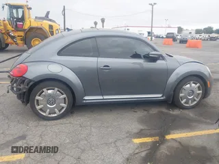 2013 Volkswagen Beetle 2.5L with VIN 3VWJP7AT6DM667477, listed as a IAAI auction lot 42215545 with 87,392 mi miles and . Bid and sale history available at DreamBid. Image 13.