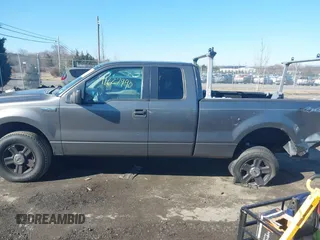 2005 Ford F-150 STX with VIN 1FTRX14W95NB07100, listed as a IAAI auction lot 41627990 with 381,000 mi miles. Bid and sale history available at carsss.com. Image 14.