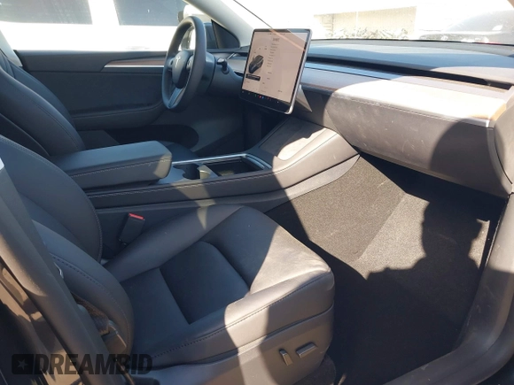 2025 Tesla Model Y Long Range with VIN 7SAYGDED2SF228414, listed as a IAAI auction lot 41706470 with 11,319 mi miles and . Bid and sale history available at DreamBid. Image 5.