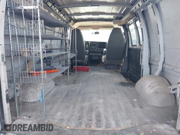 2013 Chevrolet Express Cargo z VIN 1GCWGFCA6D1145640, wystawiony jako IAAI lot #42379485 z przebiegiem 174 877 mil mil oraz . Historia ofert i sprzedaży dostępna na DreamBid. Obrazek 8.