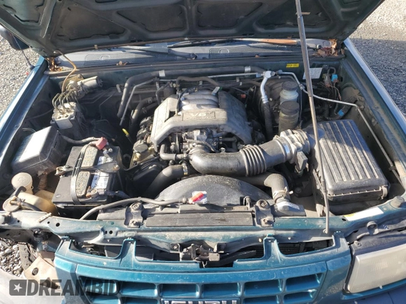 1999 Isuzu Rodeo S with VIN 4S2CM58W7X4359649, listed as a Copart auction lot 83450174 with 171,940 mi miles and Salvage title. Bid and sale history available at DreamBid. Image 13.