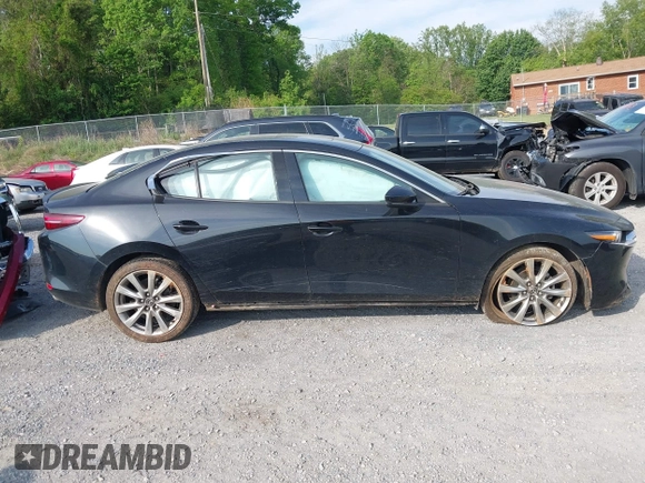 2021 Mazda 3 Premium z VIN 3MZBPADL2MM254467, wystawiony jako IAAI lot #42151557 z przebiegiem 63 282 mil mil oraz . Historia ofert i sprzedaży dostępna na DreamBid. Obrazek 14.