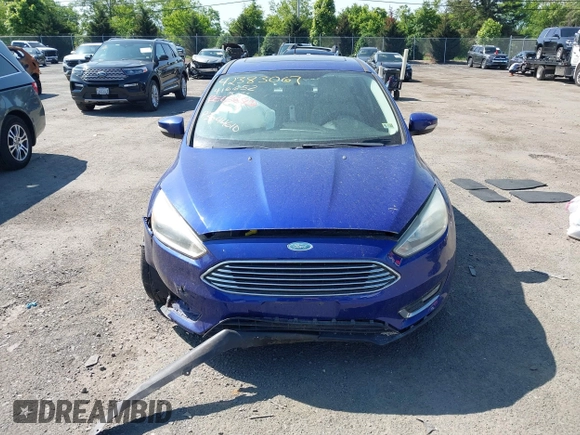 2015 Ford Focus Titanium z VIN 1FADP3N25FL291844, wystawiony jako IAAI lot #42383067 z przebiegiem 82 545 mil mil oraz . Historia ofert i sprzedaży dostępna na DreamBid. Obrazek 12.