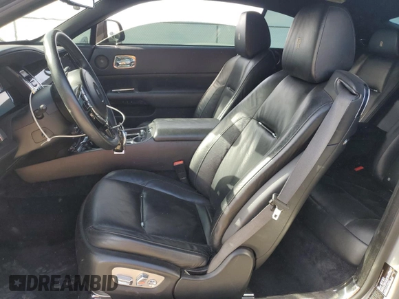 2014 Rolls-Royce Wraith z VIN SCA665C57EUX84259, wystawiony jako Copart lot #65586204 z przebiegiem 52 048 mil mil oraz Szkody całkowita. Historia ofert i sprzedaży dostępna na DreamBid. Obrazek 7.