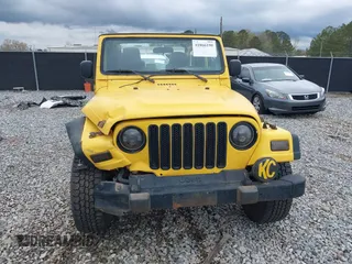 2006 Jeep Wrangler Sport z VIN 1J4FA49S06P700436, wystawiony jako IAAI lot #41866190 z przebiegiem 191 655 mil mil oraz . Historia ofert i sprzedaży dostępna na DreamBid. Obrazek 12.