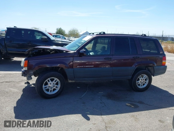 1996 Jeep Grand Cherokee Laredo with VIN 1J4GZ58S3TC391942, listed as a IAAI auction lot 41711778 with 202,765 mi miles. Bid and sale history available at carsss.com. Image 15.