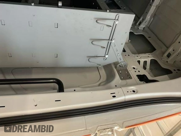 2023 Ford Transit Cargo with VIN 1FTBR1X81PKA75434, listed as a IAAI auction lot 42742887 with 5,111 mi miles and . Bid and sale history available at DreamBid. Image 4.