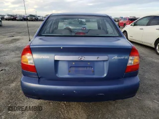 2000 Hyundai Accent z VIN KMHCG45GXYU125691, wystawiony jako Copart lot #87253294 z przebiegiem 91 062 mil mil oraz Szkoda całkowita • Salvage title. Historia ofert i sprzedaży dostępna na DreamBid. Obrazek 6.