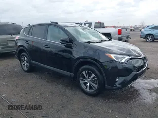 2018 Toyota RAV4 XLE with VIN 2T3WFREV9JW412755, listed as a IAAI auction lot 41889960 with 216,451 mi miles and . Bid and sale history available at carsss.com. Image 1.