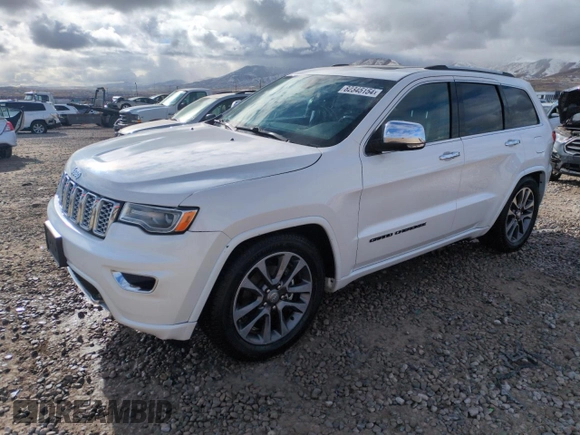 2017 Jeep Grand Cherokee Overland with VIN 1C4RJFCG7HC707767, listed as a Copart auction lot 82345154 with 96,374 mi miles and Salvage Title. Bid and sale history available at carsss.com. Image 1.