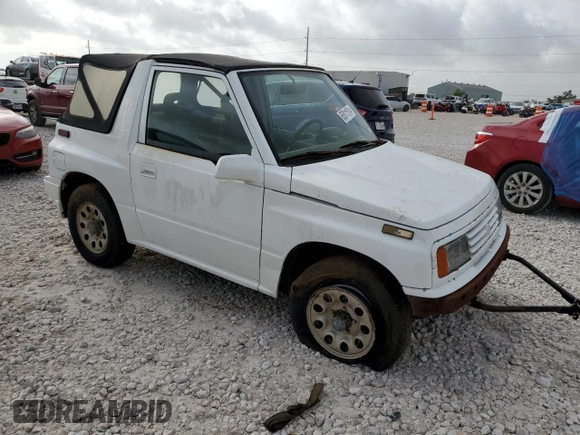 1994 Suzuki Sidekick z VIN 2S3TA01C8R6408593, wystawiony jako Copart lot #65011514 z przebiegiem 248 814 mil mil oraz Tytuł czysty. Historia ofert i sprzedaży dostępna na DreamBid. Obrazek 4.
