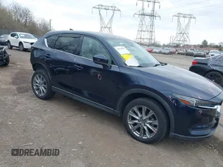 2021 Mazda CX-5 Grand Touring with VIN JM3KFADM0M1321375, listed as a IAAI auction lot 41913449 with 88,178 mi miles. Bid and sale history available at carsss.com. Image 1.