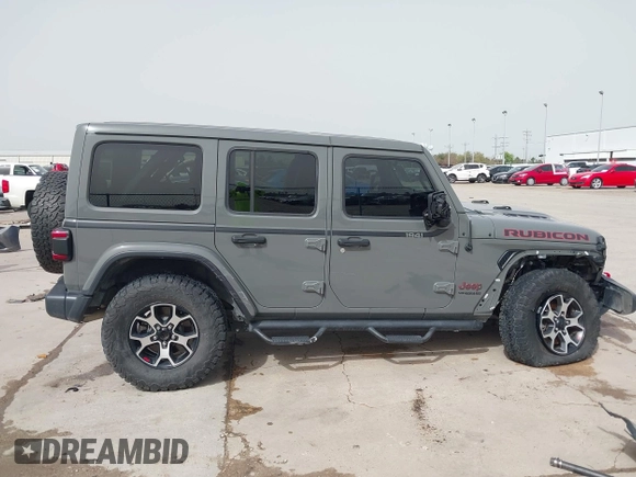 2020 Jeep Wrangler Unlimited Rubicon z VIN 1C4HJXFG2LW267154, wystawiony jako IAAI lot #41745497 z przebiegiem 28 692 mil mil oraz . Historia ofert i sprzedaży dostępna na DreamBid. Obrazek 14.