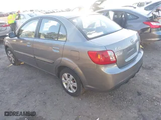 2011 Kia Rio LX with VIN KNADH4A38B6940831, listed as a IAAI auction lot 41287266 with 185,924 mi miles. Bid and sale history available at carsss.com. Image 3.