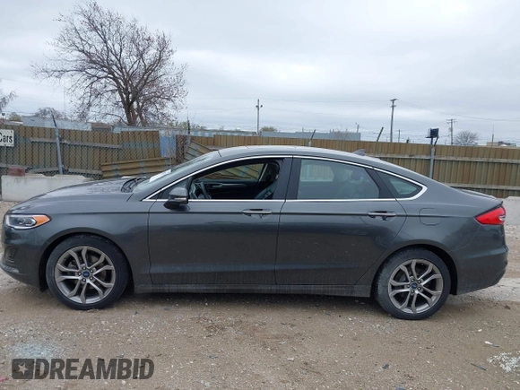 2019 Ford Fusion SEL with VIN 3FA6P0CDXKR129411, listed as a IAAI auction lot 42082323 with 126,048 mi miles and . Bid and sale history available at DreamBid. Image 14.