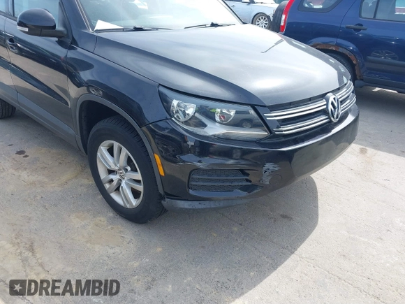 2012 Volkswagen Tiguan SE with VIN WVGAV7AXXCW526403, listed as a IAAI auction lot 41852974 with 125,376 mi miles and . Bid and sale history available at DreamBid. Image 6.