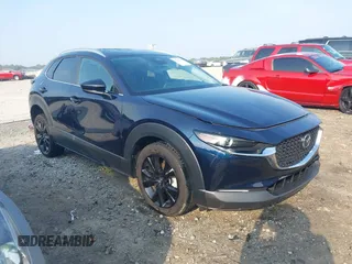 2024 Mazda CX-30 S Select Sport with VIN 3MVDMBBM3RM606581, listed as a IAAI auction lot 42591136 with 21,598 mi miles and . Bid and sale history available at DreamBid. Image 1.