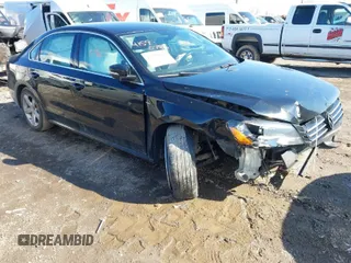 2015 Volkswagen Passat 1.8T Limited Edition with VIN 1VWAT7A31FC118317, listed as a IAAI auction lot 41590786 with 191,021 mi miles. Bid and sale history available at carsss.com. Image 1.