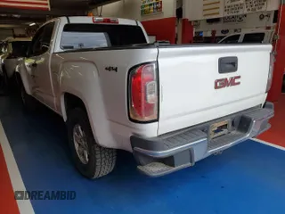 2015 GMC Canyon z VIN 1GTH6AE33F1229463, wystawiony jako IAAI lot #42399992 z przebiegiem 123 157 mil mil oraz . Historia ofert i sprzedaży dostępna na DreamBid. Obrazek 6.