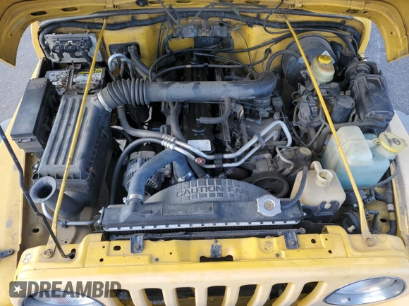 2000 Jeep Wrangler Sport with VIN 1J4FA49SXYP745676, listed as a Copart auction lot 63096755 with 147,226 mi miles and Salvage title. Bid and sale history available at DreamBid. Image 12.