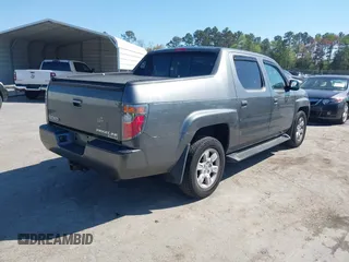 2007 Honda Ridgeline RTL z VIN 2HJYK16557H531198, wystawiony jako IAAI lot #41998612 z przebiegiem 194 975 mil mil oraz . Historia ofert i sprzedaży dostępna na DreamBid. Obrazek 4.