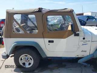 1998 Jeep Wrangler Sport z VIN 1J4FY19S3WP776209, wystawiony jako IAAI lot #42493513 z przebiegiem 113 130 mil mil oraz . Historia ofert i sprzedaży dostępna na DreamBid. Obrazek 14.