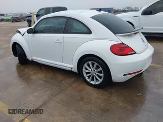 2018 Volkswagen Beetle S with VIN 3VWFD7AT3JM703443, listed as a IAAI auction lot 41437909 with 76,757 mi miles. Bid and sale history available at carsss.com. Image 3.