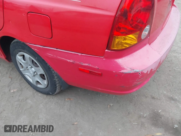 2005 Hyundai Accent GLS with VIN KMHCG45CX5U614083, listed as a IAAI auction lot 41006582 with 72,516 mi miles. Bid and sale history available at carsss.com. Image 6.
