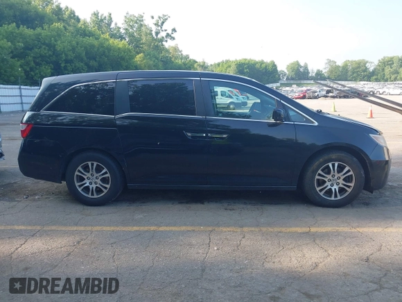 2012 Honda Odyssey EX-L with VIN 5FNRL5H60CB075811, listed as a IAAI auction lot 42518159 with 243,186 mi miles and . Bid and sale history available at DreamBid. Image 13.