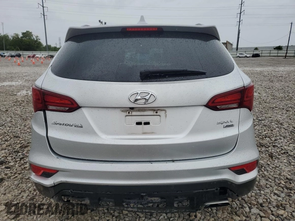 2017 Hyundai Santa Fe 2.4L z VIN 5XYZUDLB8HG500297, wystawiony jako Copart lot #58005165 z przebiegiem 91 871 mil mil oraz Szkoda całkowita • Salvage title. Historia ofert i sprzedaży dostępna na DreamBid. Obrazek 6.