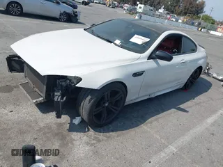 2013 BMW M6 z VIN WBSLX9C52DD159906, wystawiony jako IAAI lot #42095042 z przebiegiem 105 463 mil mil oraz . Historia ofert i sprzedaży dostępna na DreamBid. Obrazek 2.