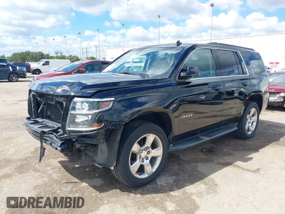 2015 Chevrolet Tahoe LT with VIN 1GNSCBKCXFR214072, listed as a IAAI auction lot 40512435 with 98,955 mi miles and . Bid and sale history available at DreamBid. Image 2.