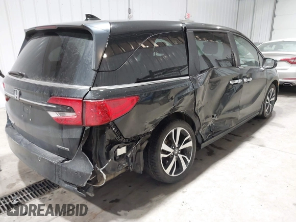 2023 Honda Odyssey Touring z VIN 5FNRL6H85PB039450, wystawiony jako IAAI lot #41504351 z przebiegiem 51 000 mil mil oraz . Historia ofert i sprzedaży dostępna na DreamBid. Obrazek 4.