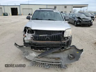 2011 Mercury Mariner z VIN 4M2CN8B73BKJ06886, wystawiony jako Copart lot #50308485 z przebiegiem 118 584 mil mil oraz Szkoda całkowita • Salvage title. Historia ofert i sprzedaży dostępna na DreamBid. Obrazek 5.